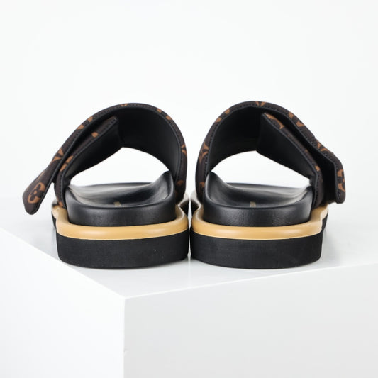 L***V Monogram Canvas Metal Plaque Slide Sandals — SS24 Wide Band Slip-On Pool Beach Slippers (4 Colors)