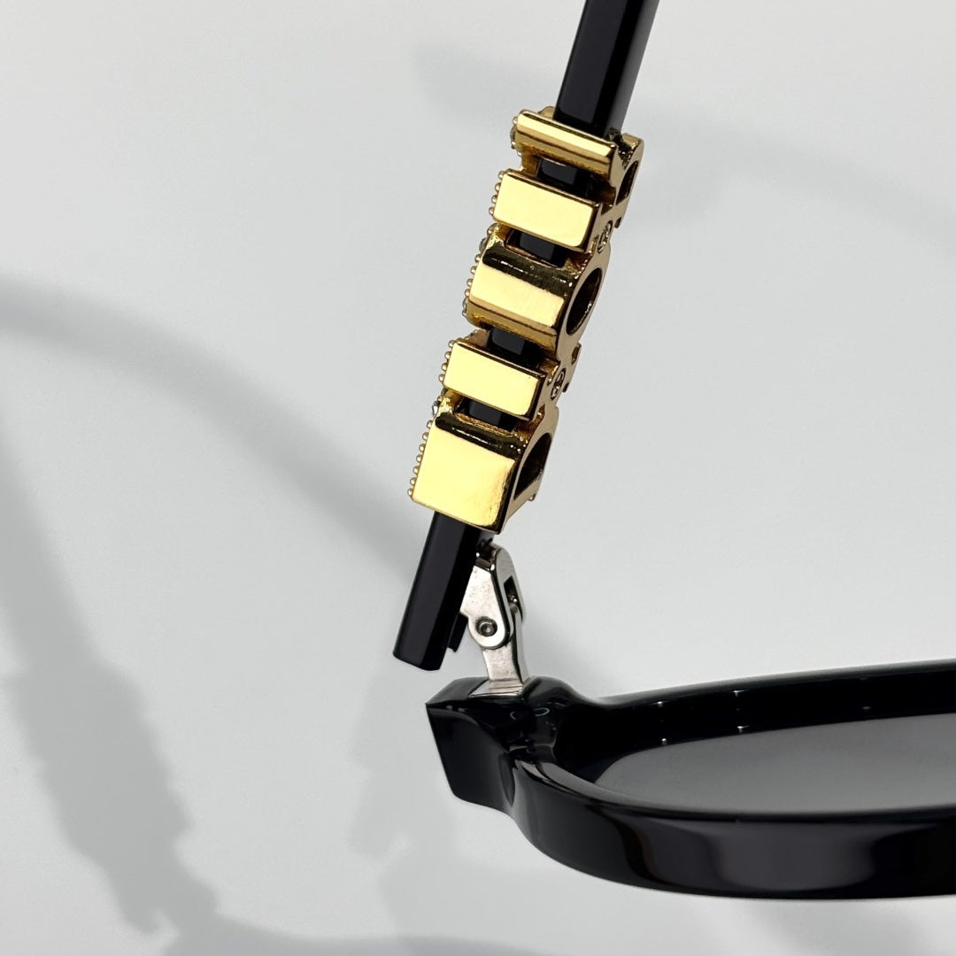 D**R Small Oval Sunglasses | Gloss Black Acetate Frame, Crystal-Set DIOR Letter Temple Block, Gold Metal Nose Bridge, Flat Grey Lenses
