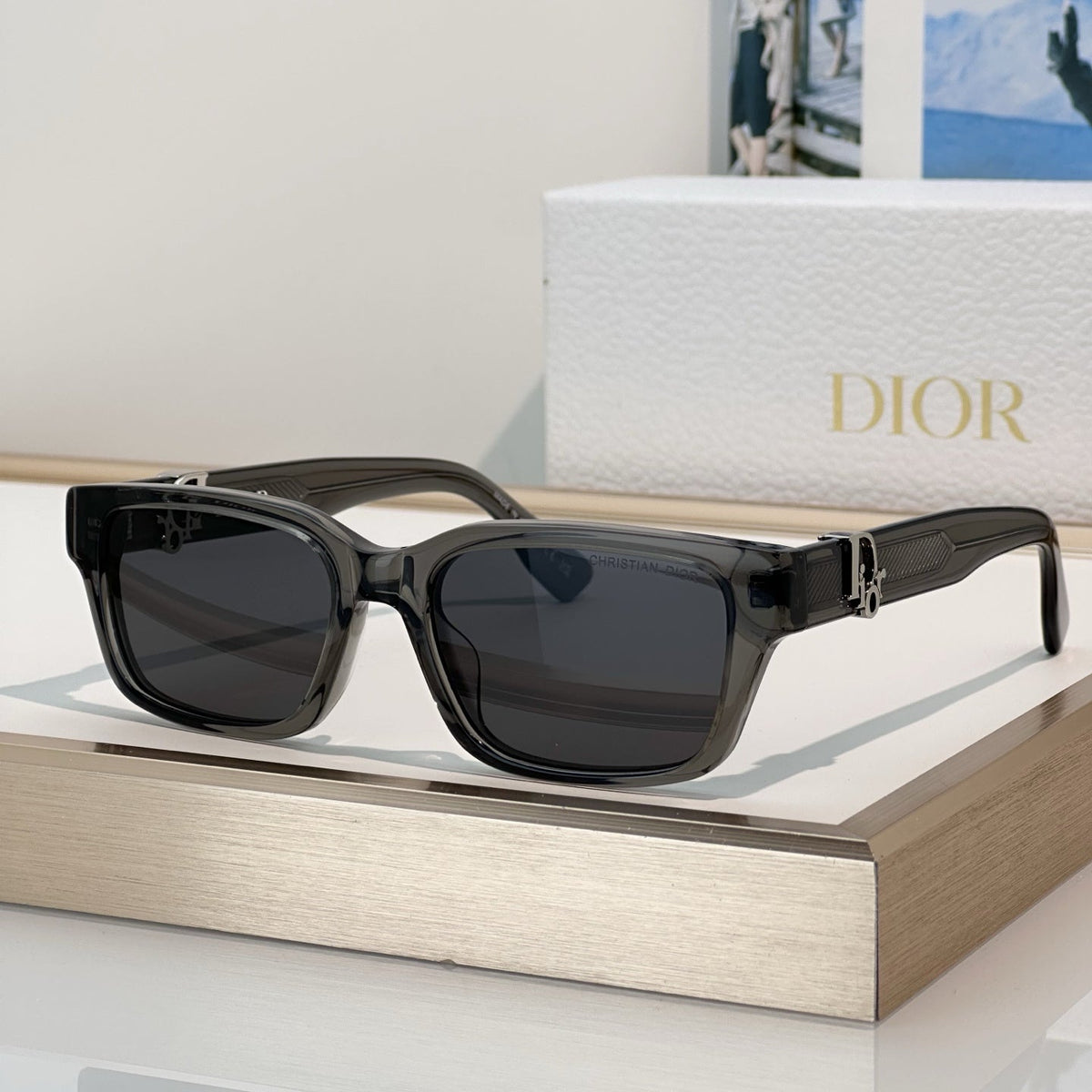 D**R Thick Square Sunglasses with Crystal Grey Transparent Frame, Navy Blue Lenses & Engraved CD Temple Hardware