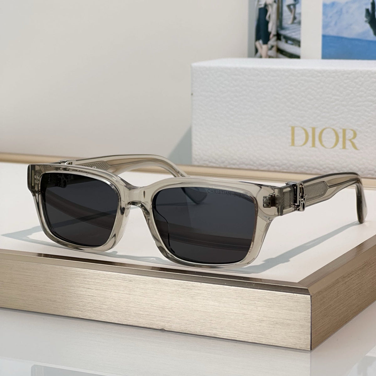 D**R Thick Square Sunglasses with Crystal Grey Transparent Frame, Navy Blue Lenses & Engraved CD Temple Hardware