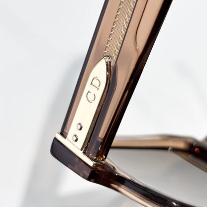 D**R Bold Square Acetate Sunglasses | Transparent Champagne-Brown Frame, Gold CD Metal Inlay, Three-Rivet Temple, Flat Brown Lenses