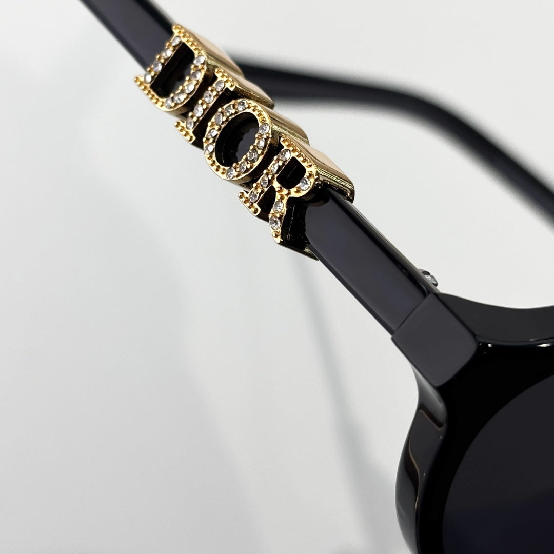 D**R Small Oval Sunglasses | Gloss Black Acetate Frame, Crystal-Set DIOR Letter Temple Block, Gold Metal Nose Bridge, Flat Grey Lenses