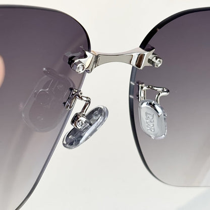 D**R Oversized Rimless Butterfly Sunglasses with Grey Gradient Lens, Silver Temples & Sculptural Black Flower Cluster Embellishment