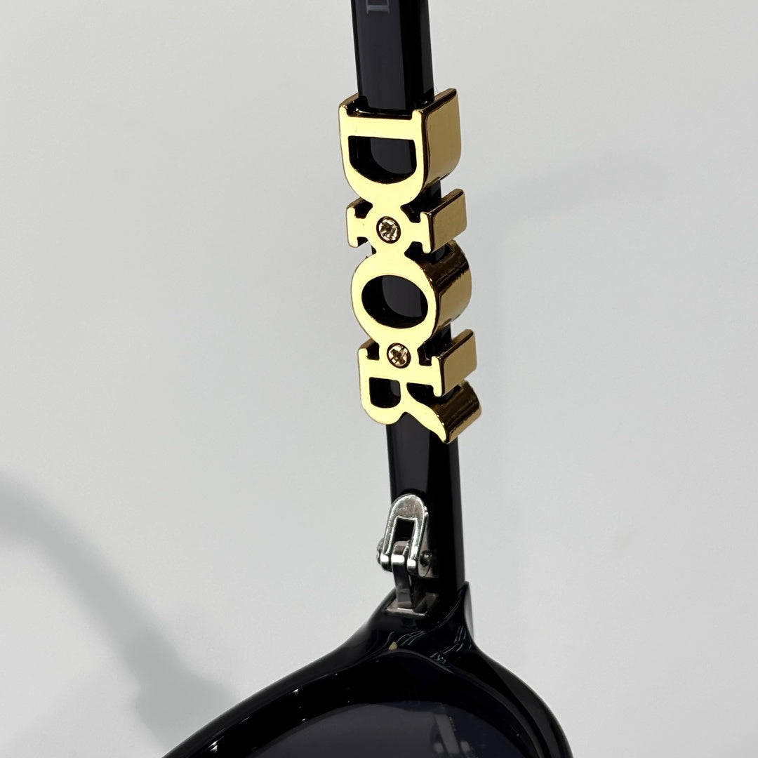D**R Small Oval Sunglasses | Gloss Black Acetate Frame, Crystal-Set DIOR Letter Temple Block, Gold Metal Nose Bridge, Flat Grey Lenses