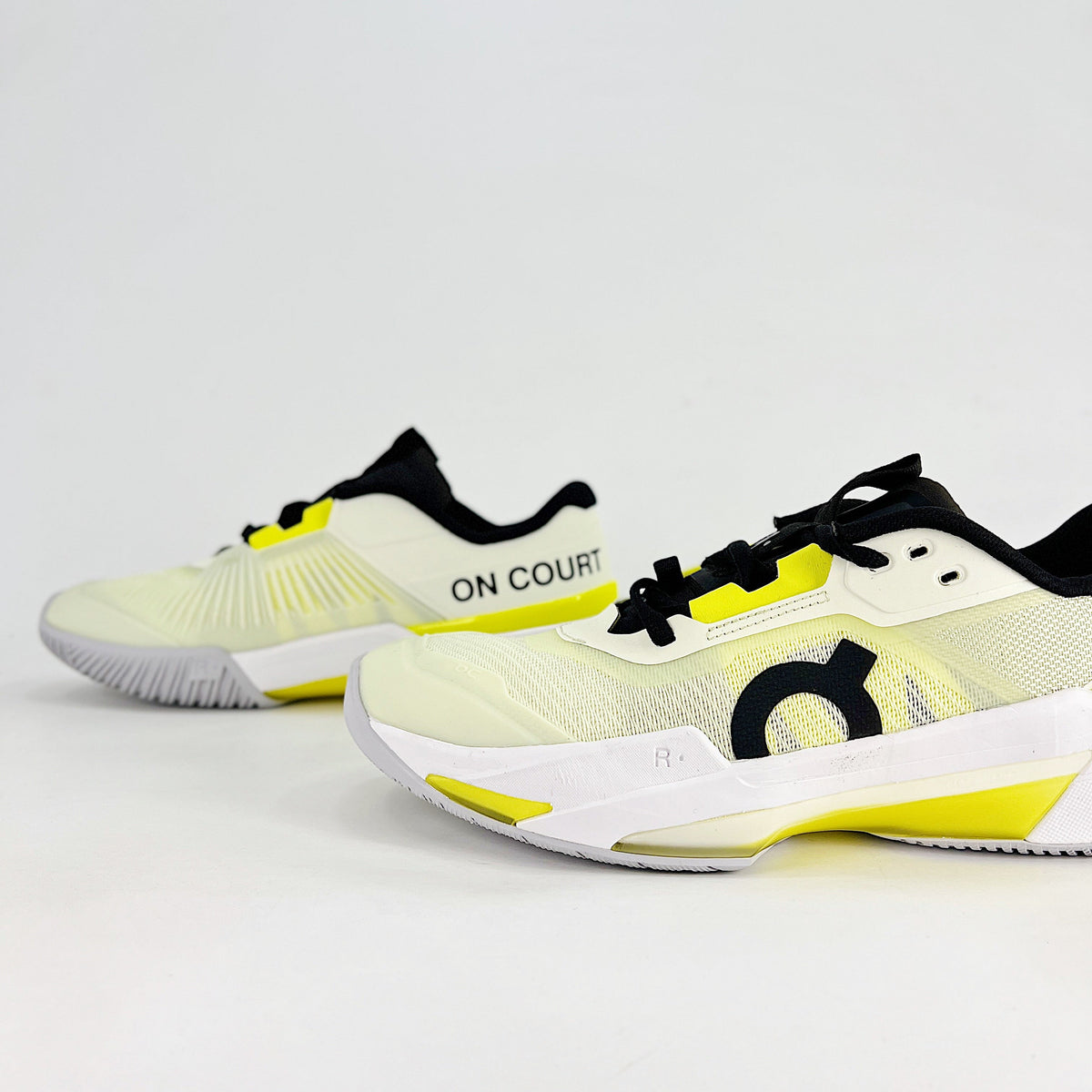 On THE ROGER Pro Fire – Unisex Lightweight Breathable Anti-Slip Shock-Absorbing Low-Top Tennis Shoes | White, Neon Yellow & Black