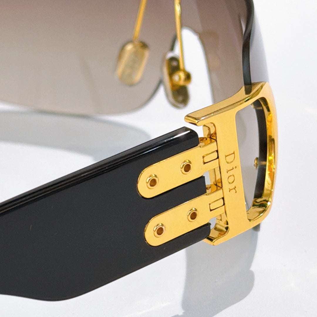 D**R Rimless Wraparound Shield Sunglasses with Grey Purple Gradient Lens, Black Temples & Oversized Gold CD Logo Hardware