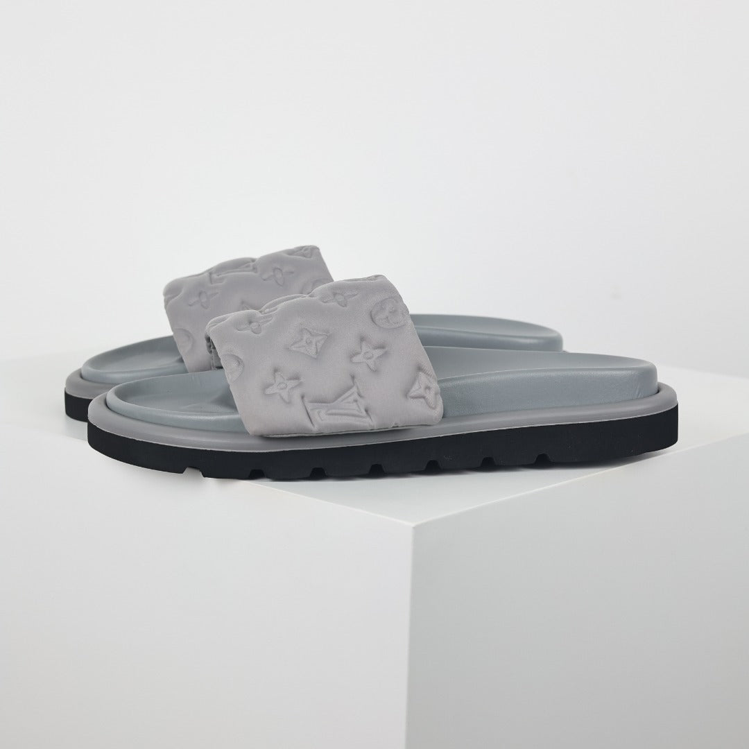 L***V Light Grey Tonal Embossed Monogram Wide Strap Flat Slide Sandals — 2024 Spring Summer Boutique Limited Edition
