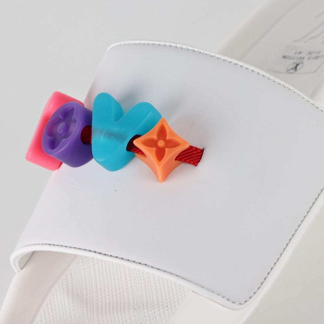 L***V Rubber Pool Slide Sandals — SS23 Limited Edition 3D Logo Charm Slip-On Beach Slippers (White)
