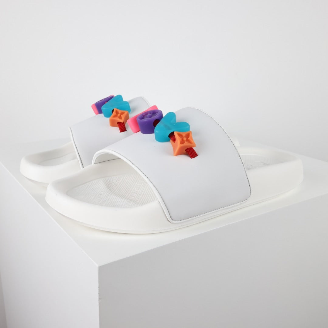 L***V Rubber Pool Slide Sandals — SS23 Limited Edition 3D Logo Charm Slip-On Beach Slippers (White)