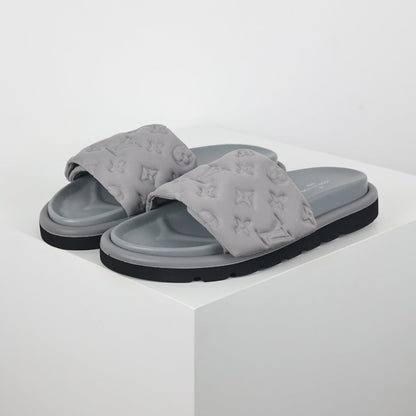 L***V Light Grey Tonal Embossed Monogram Wide Strap Flat Slide Sandals — 2024 Spring Summer Boutique Limited Edition
