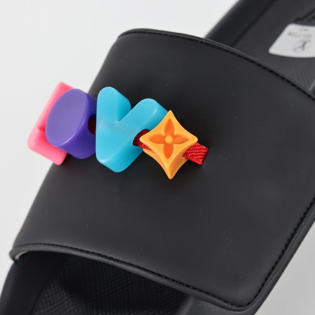 L***V Rubber Pool Slide Sandals — SS23 Limited Edition 3D Logo Charm Slip-On Beach Slippers (Black)