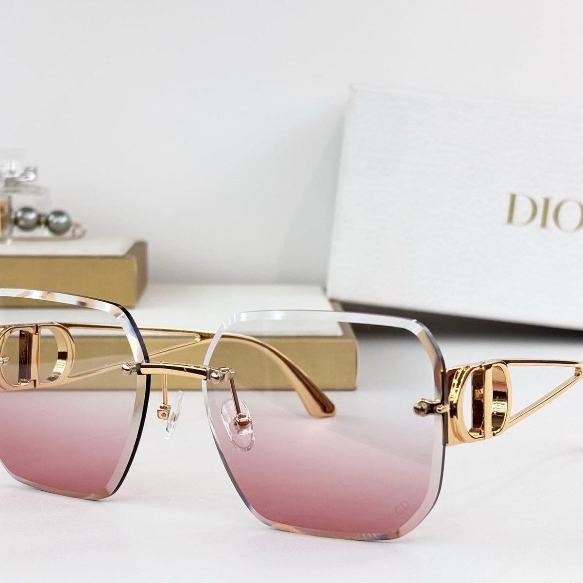 D**R 30Montaigne S6U Rimless Sunglasses | Gold Metal Frame, Brown Gradient Bevelled Lenses, CD Logo Temple | Multiple Colors