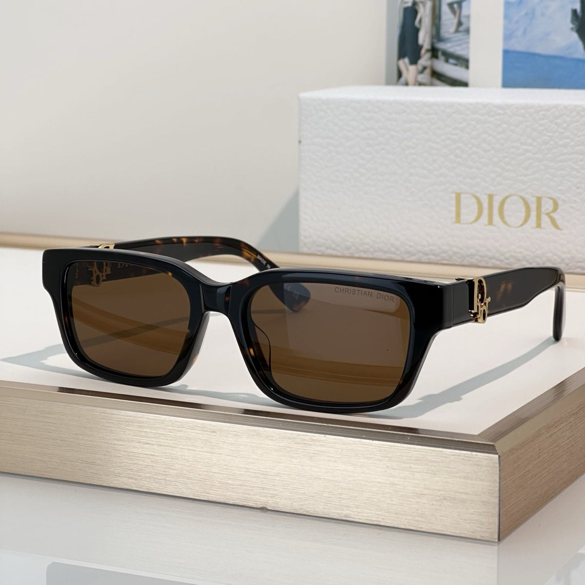 D**R Thick Square Sunglasses with Crystal Grey Transparent Frame, Navy Blue Lenses & Engraved CD Temple Hardware