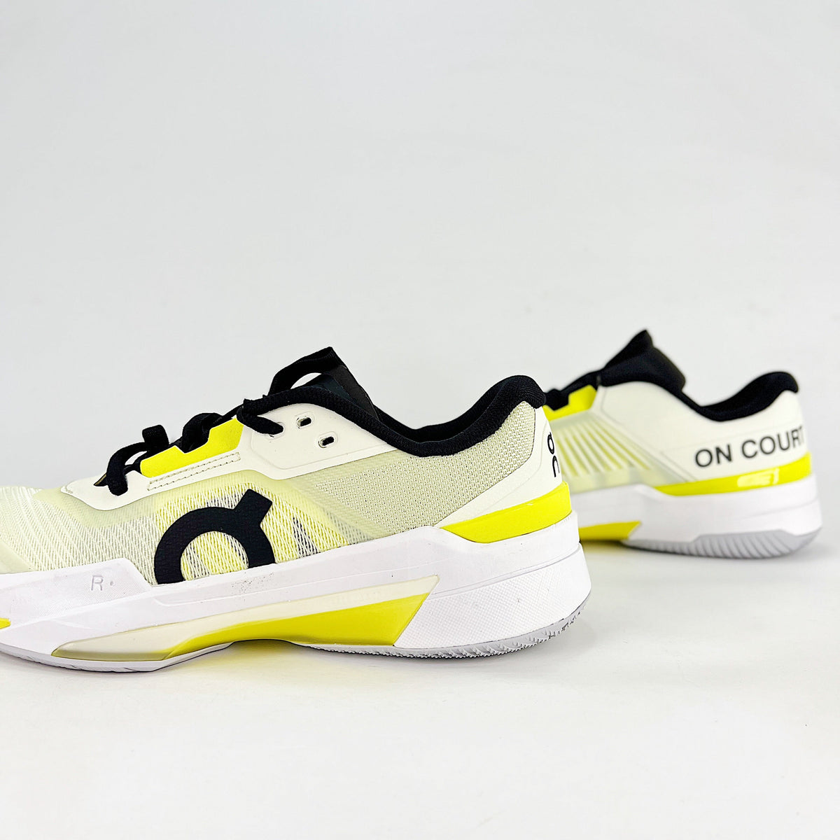 On THE ROGER Pro Fire – Unisex Lightweight Breathable Anti-Slip Shock-Absorbing Low-Top Tennis Shoes | White, Neon Yellow & Black