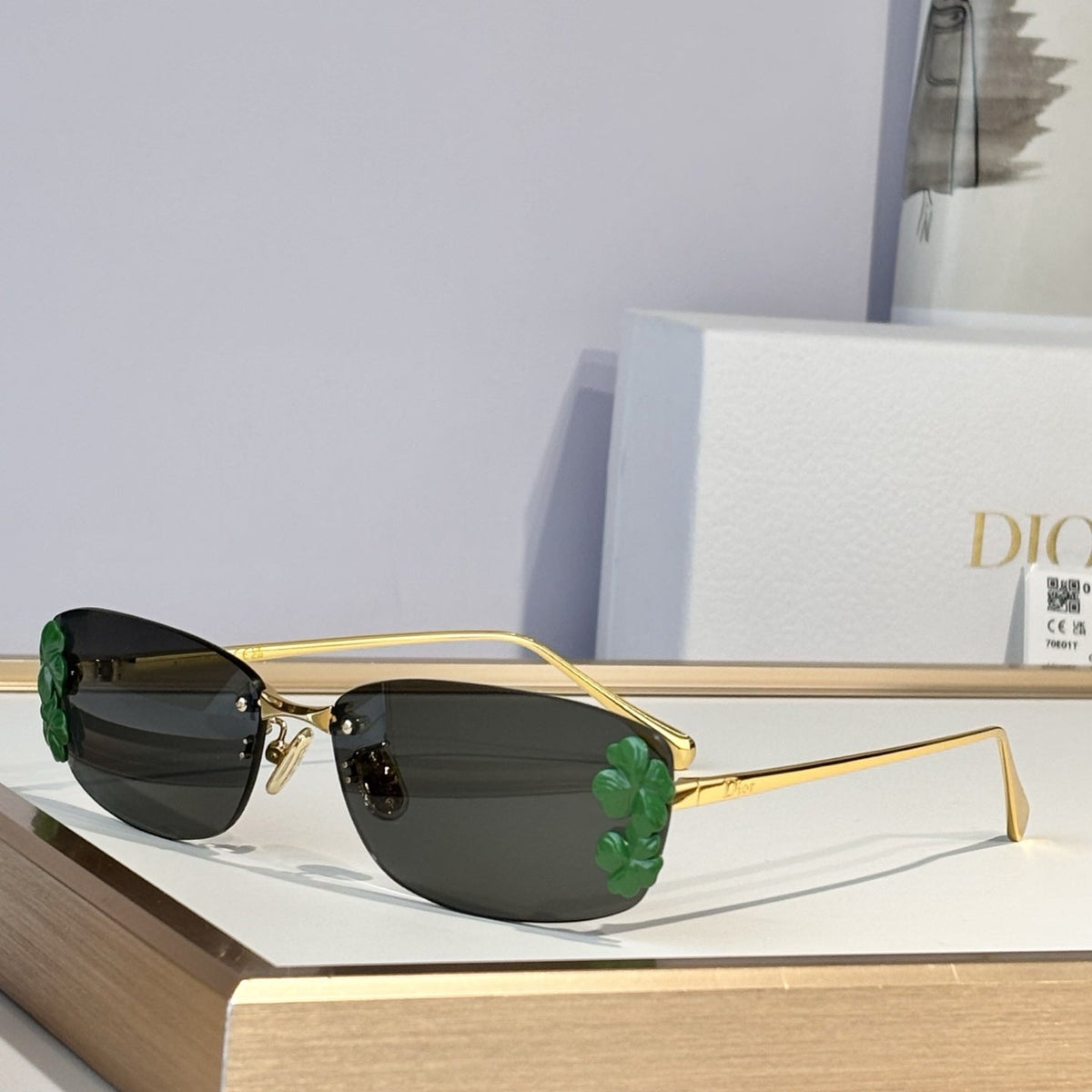 D**R Slim Rimless Rectangular Sunglasses with Dark Green Solid Lenses, Gold Metal Temples & Emerald Green Flower Cluster Embellishment