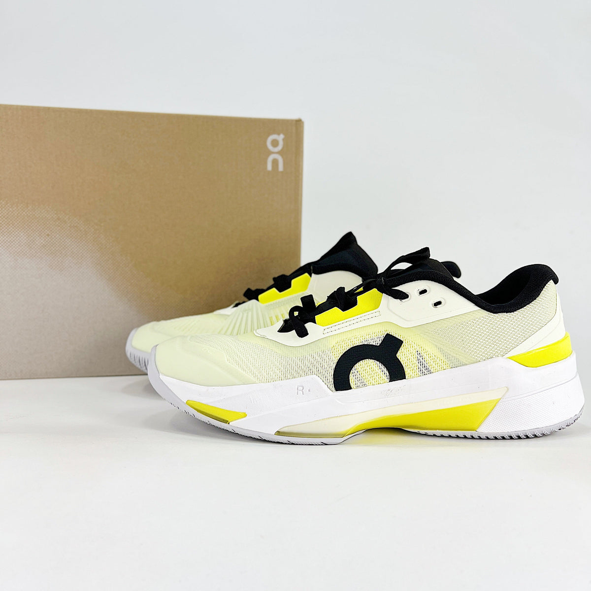 On THE ROGER Pro Fire – Unisex Lightweight Breathable Anti-Slip Shock-Absorbing Low-Top Tennis Shoes | White, Neon Yellow & Black