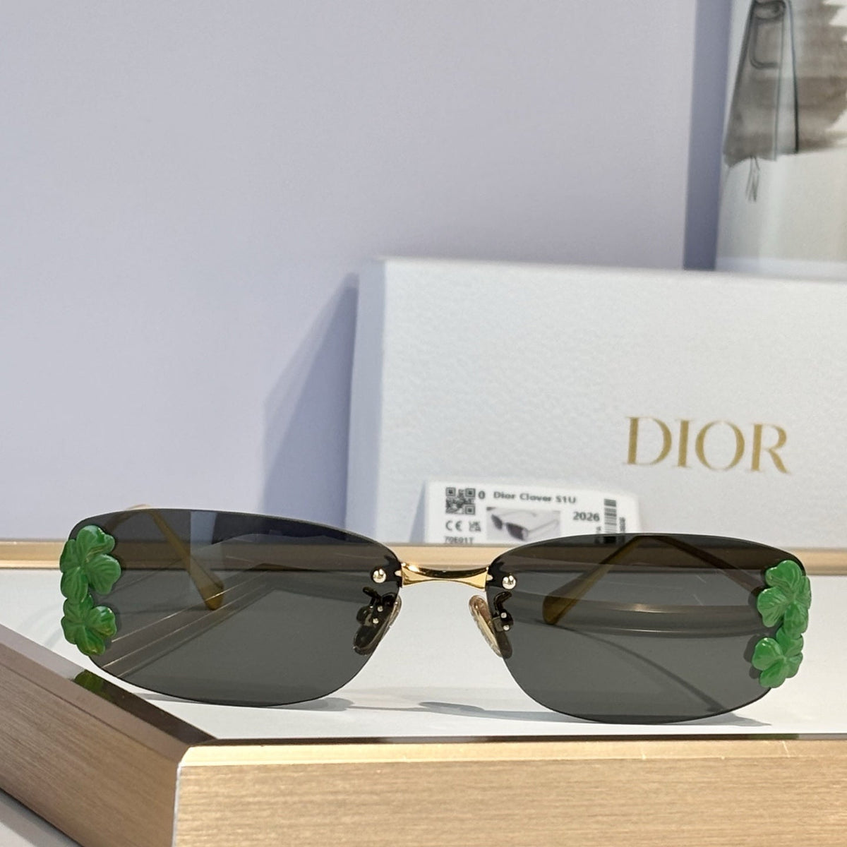 D**R Slim Rimless Rectangular Sunglasses with Dark Green Solid Lenses, Gold Metal Temples & Emerald Green Flower Cluster Embellishment