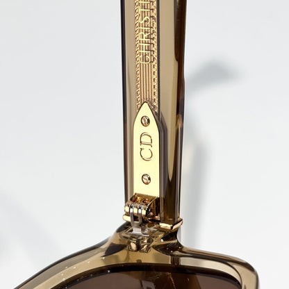 D**R Oversized Square Acetate Sunglasses | Transparent Champagne Frame, Gold CD Rivet, Gold Metal Tip, Flat Brown Lenses