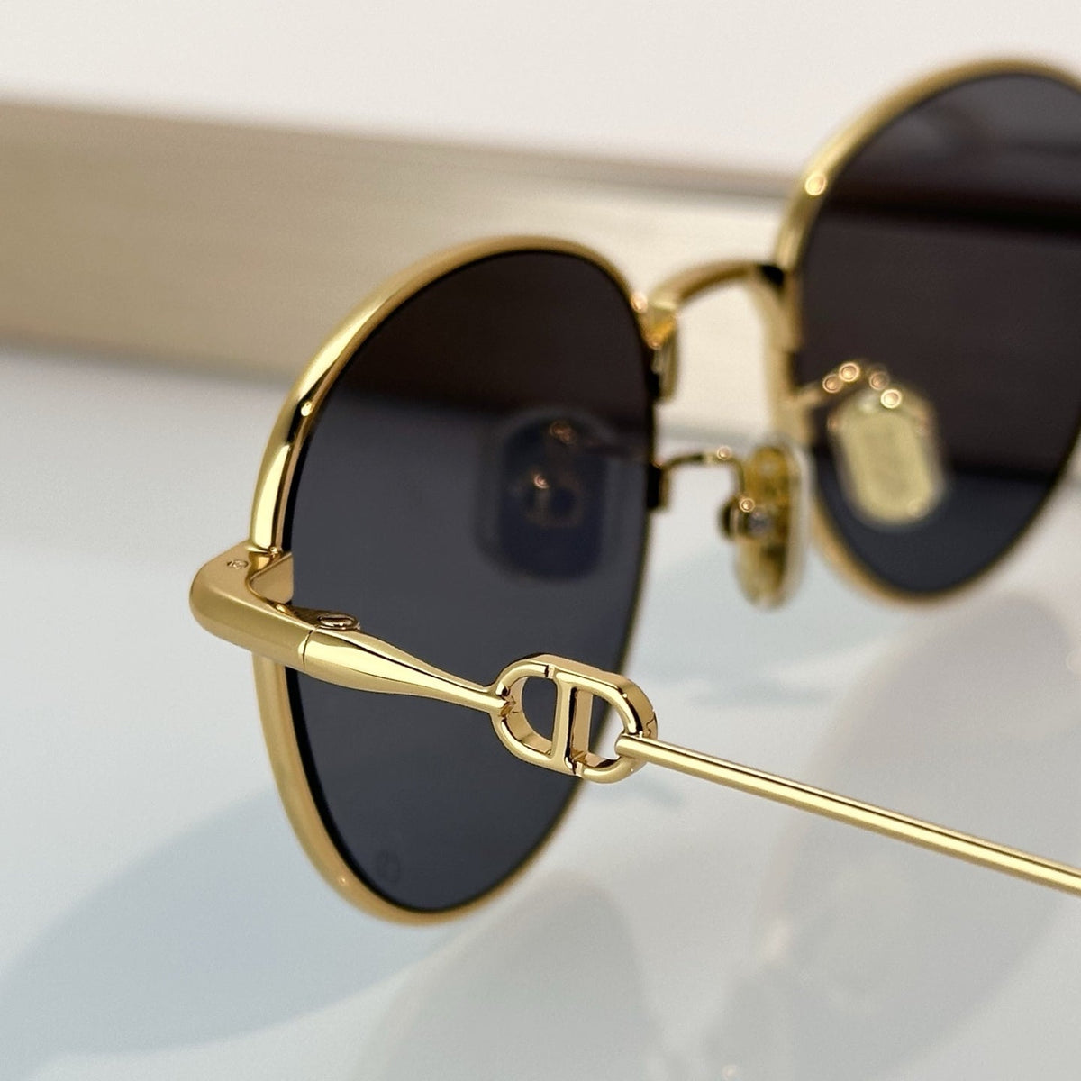 D**R Slim Round Sunglasses with Polished Gold Metal Wire Frame, Dark Grey Solid Lenses & CD Monogram Lens Detail