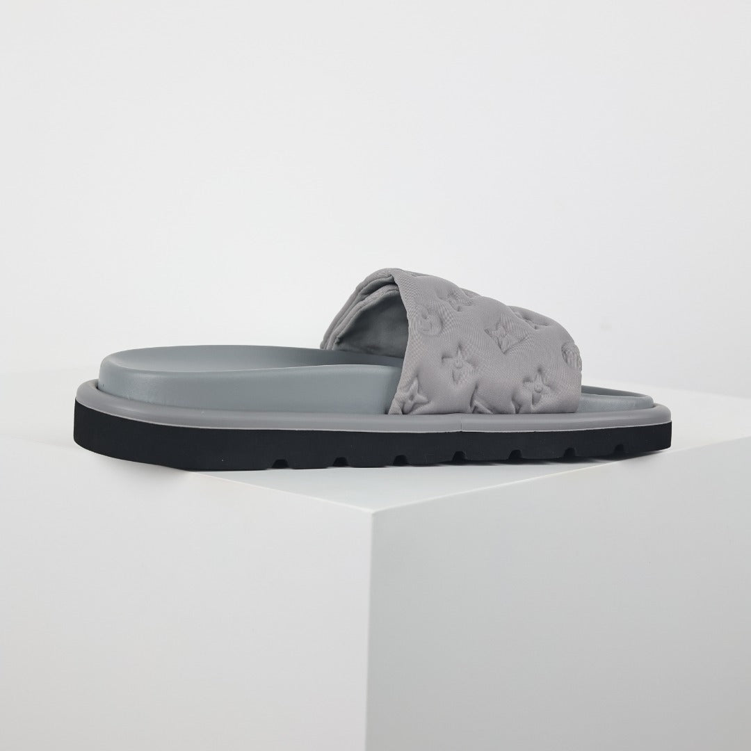 L***V Light Grey Tonal Embossed Monogram Wide Strap Flat Slide Sandals — 2024 Spring Summer Boutique Limited Edition