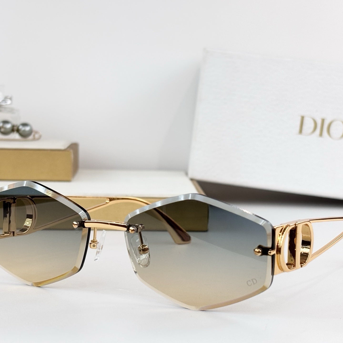 D**R 30Montaigne S6U Rimless Sunglasses | Gold Metal Frame, Brown Gradient Bevelled Lenses, CD Logo Temple | Multiple Colors